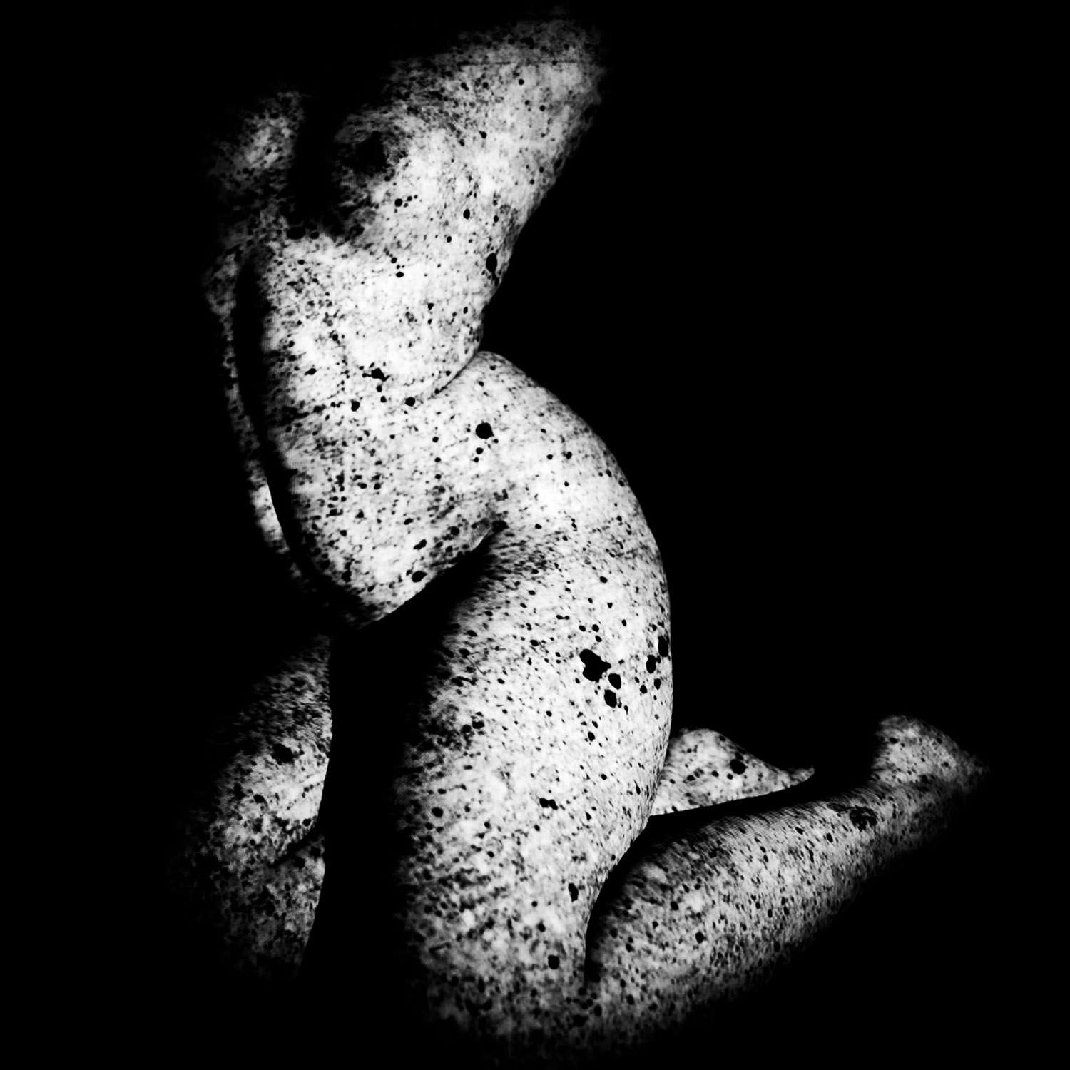 black and white study of coarse skin-like structure with heavy shadow areas