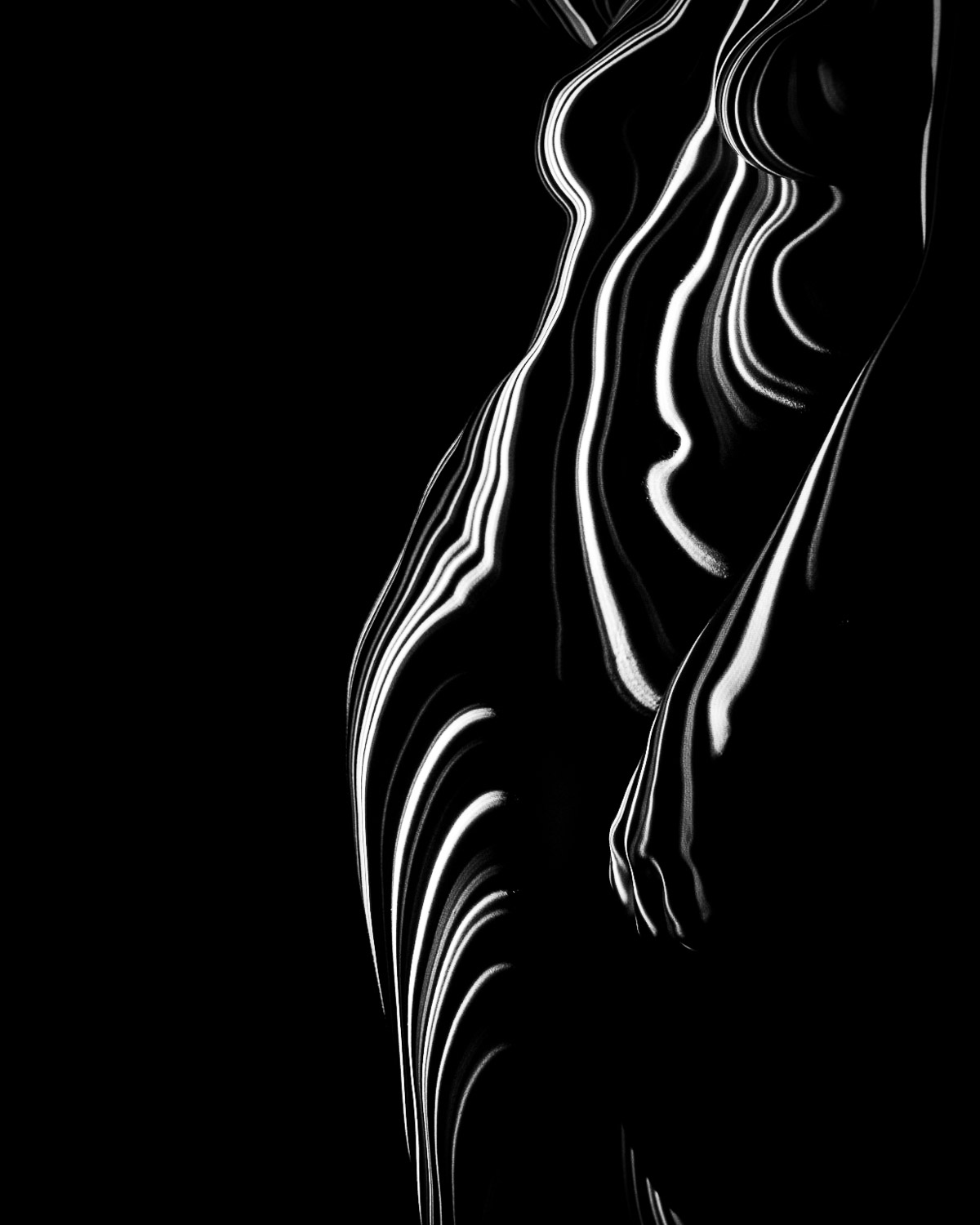 dense projected light lines bending vertically across a curved form in deep shadow